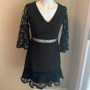Black Junior Dress With Lace Sleeves and Open Midriff